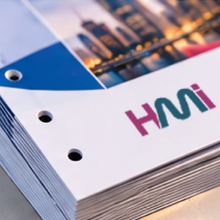 Precision hole punching for printed brochures